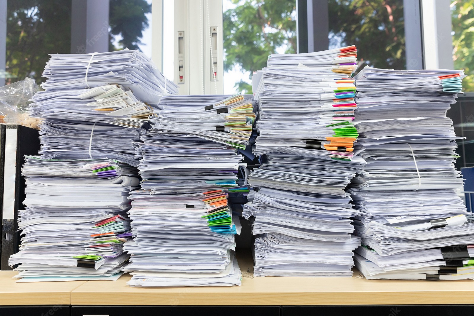 Piles of paperwork on a desk